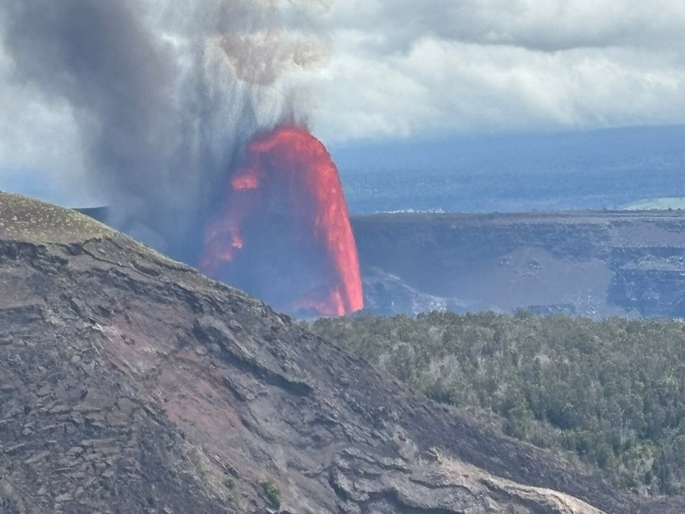 Bucket List Travel Adventures: Eruption in distance of Kilauea Iki Crater