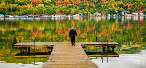 Bright Orange and Bright Yellow Leaves Reflecting on Seneca Lake