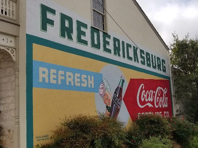 Vintage Coca-Cola wall mural, a fun photo backdrop for a fredericksburg tx bachelorette weekend.