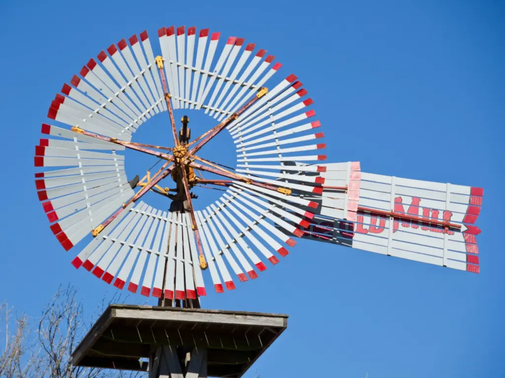 The historic wooden Old Mill windmill in Fredericksburg, a charming landmark for a texas travel itinerary.